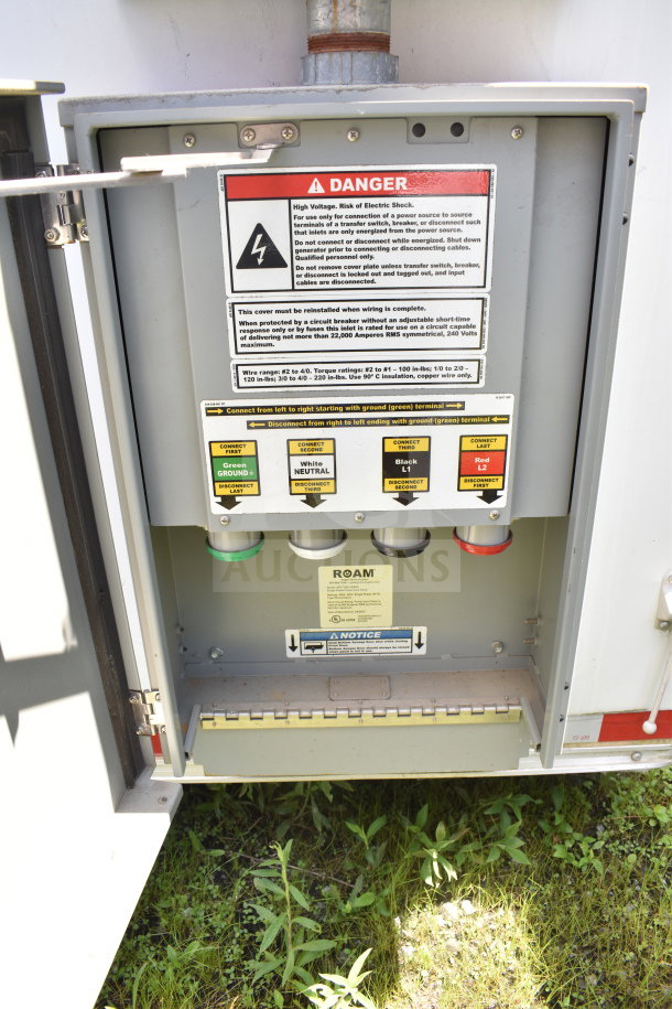 Control panel inside a 2021 Diamond Cargo food trailer, showing danger labels and wiring instructions.