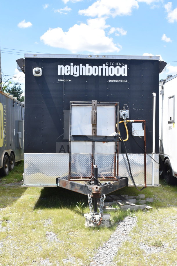 2020 Diamond Cargo 8.5x24 fully outfitted food trailer, black exterior, tagged "Neighborhood Kitchens." VIN 53NBE2427L1083687.