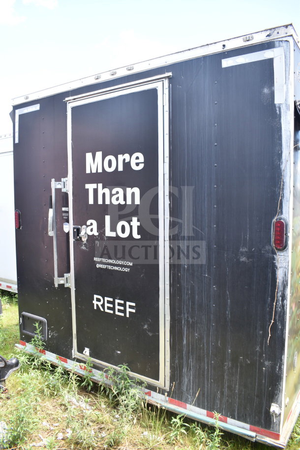 2020 Diamond Cargo 8.5x24 food trailer, black exterior, side door with "More Than a Lot" and "REEF" branding, moderate wear.