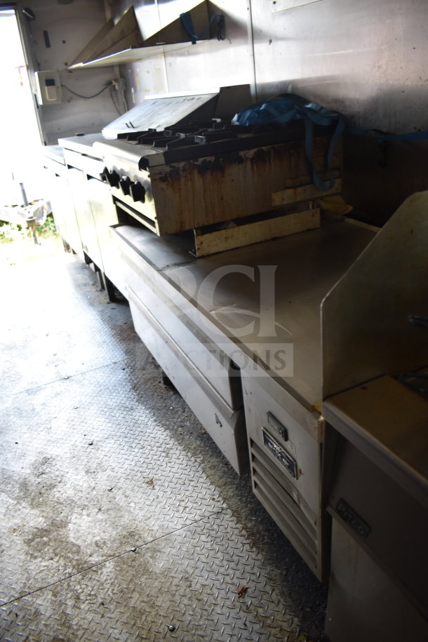2020 Diamond Cargo 8.5x24 food trailer interior with stainless steel kitchen equipment, showing signs of use.