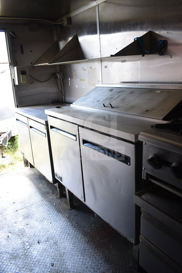 2020 Diamond Cargo 8.5x24 food trailer interior; stainless steel counters, storage, well-maintained condition.