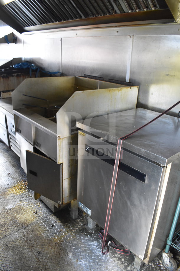 2020 Diamond Cargo 8.5x24 food trailer interior with stainless steel appliances, including fryer and freezer. Signs of use visible.