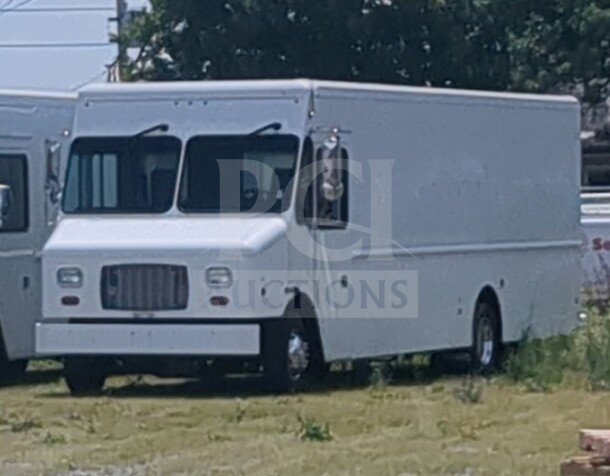 2021 Ford Step Van, white finish, VIN 1F66F5KN3M0A01361, parked outdoors, good condition.