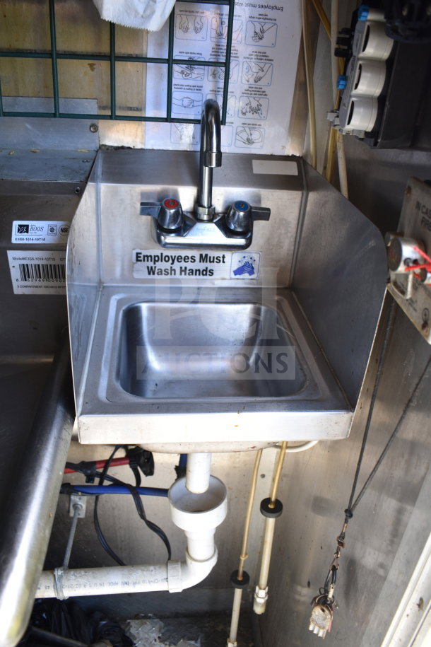 Stainless steel sink in a 2020 Diamond Cargo food trailer with "Employees Must Wash Hands" sticker.