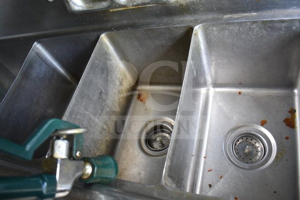 Three-compartment stainless steel sink inside a 2020 Diamond Cargo 8.5x24 food trailer, showing light wear and residue.