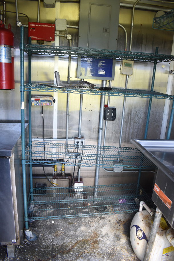 2020 Diamond Cargo 8.5x24 food trailer interior. Features include shelving, a fire extinguisher, and electrical panel. Fair condition.