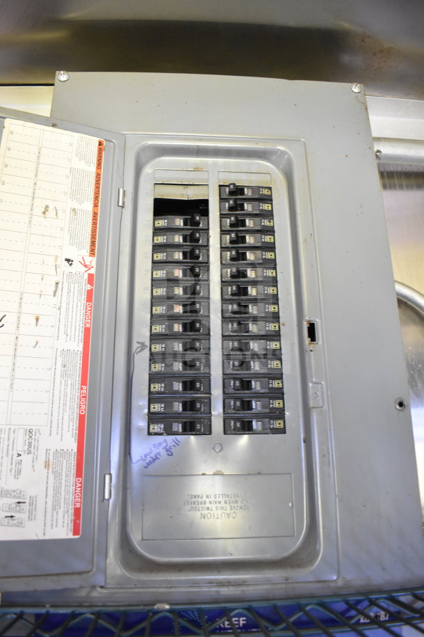 Electrical panel of a 2020 Diamond Cargo food trailer showing circuit breakers and safety labels.