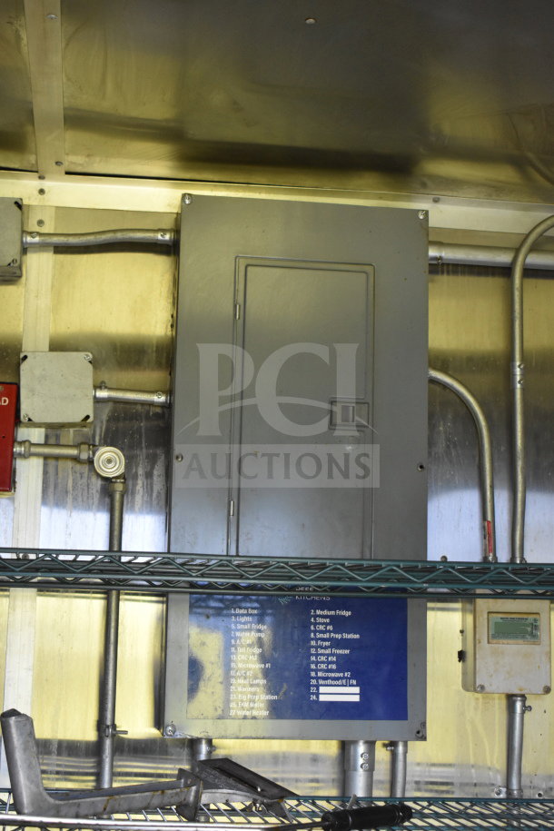 2020 Diamond Cargo 8.5x24 food trailer interior showing electrical panel, labeled circuits, and metal shelving.
