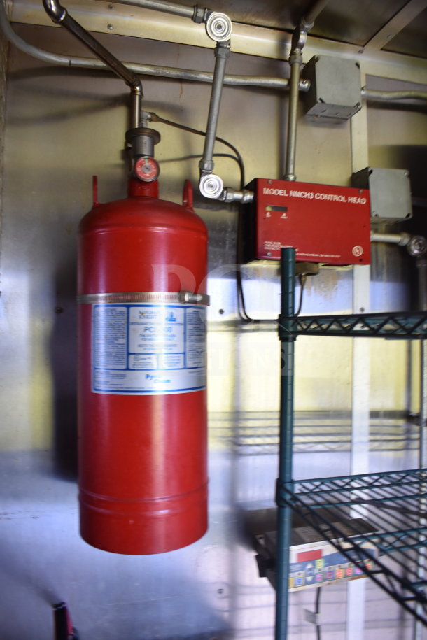 2020 Diamond Cargo food trailer interior showing fire suppression system and shelving. Model: MICR3 control head. VIN: 53NBE2427L1083687.