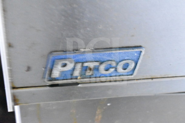 Close-up of a Pitco brand label on metal equipment, part of the 2020 Diamond Cargo 8.5x24 food trailer.