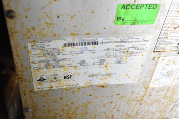 Rusty label on the 2020 Diamond Cargo food trailer equipment, showing specifications like 122000 BTU/hr and NSF certification.