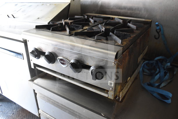 2020 Diamond Cargo 8.5x24 food trailer interior; features Wells stove with visible wear, grease hood, and refrigeration units.
