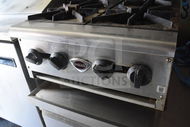 2020 Diamond Cargo 8.5x24 food trailer kitchen, featuring a Wells burner unit, visible grease hood, and stainless steel finish.
