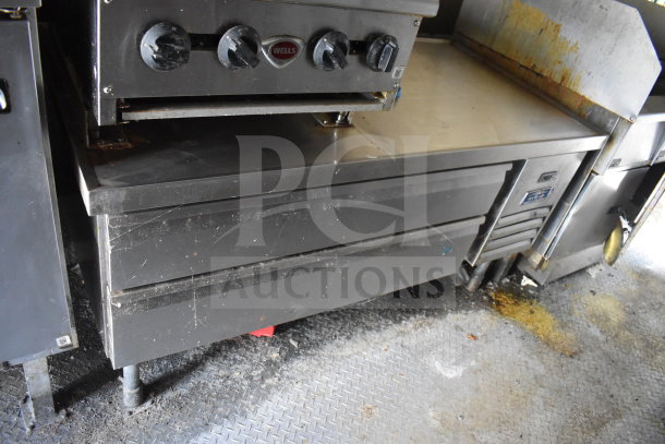 2020 Diamond Cargo 8.5x24 food trailer interior with fryer, Wells grease hood, and refrigeration, showing wear. VIN 53NBE2427L1083687.