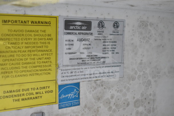 Arctic Air commercial refrigerator label showing model AUC48RZ, warnings, serial number H20027277, and Energy Star rating.