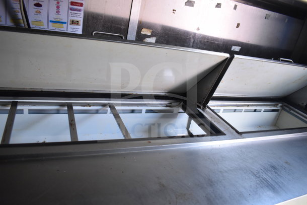2020 Diamond Cargo 8.5x24 food trailer interior with open refrigeration compartments and stainless steel surfaces.