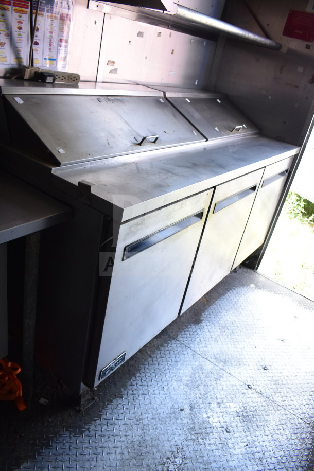 2020 Diamond Cargo 8.5x24 food trailer with stainless steel refrigeration unit, grease hood, and prep area. VIN visible.