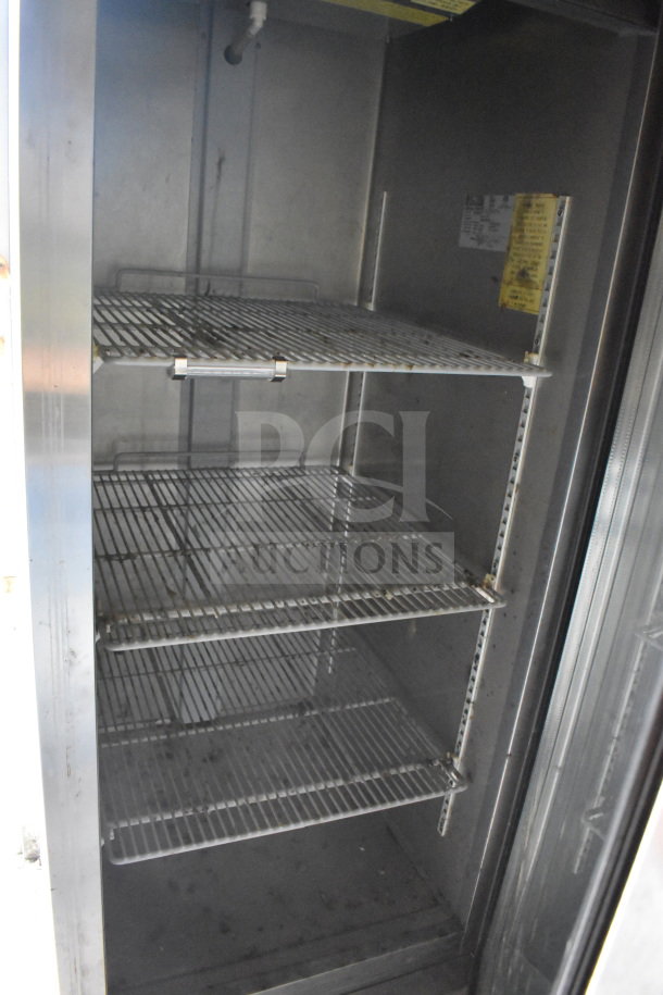 Diamond Cargo 8.5x24 food trailer interior showing shelving for refrigeration. Clean with visible wiring and labels.