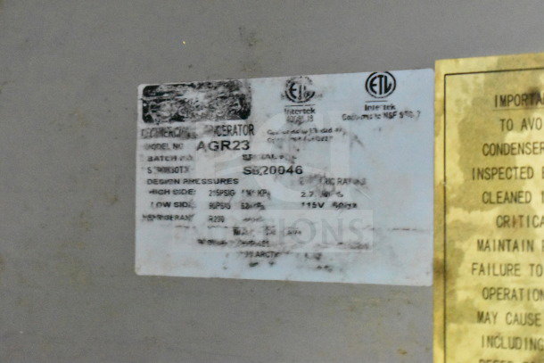 Label on 2020 Diamond Cargo food trailer's refrigeration unit, model AGR23, shows design pressures and ETL certification.