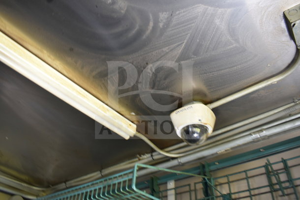 Ceiling interior of 2020 Diamond Cargo food trailer showing installed surveillance camera and overhead lighting.
