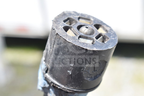 Close-up of a metal hitch component from the 2020 Diamond Cargo food trailer, showing signs of wear.