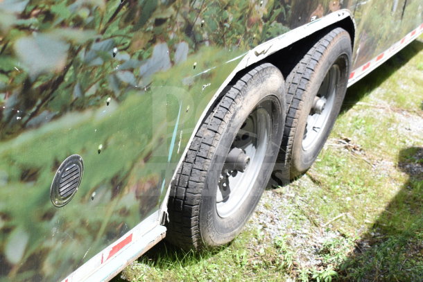 2020 Diamond Cargo 8.5x24 food trailer, exterior view, dual axle, camouflage design, light wear visible.