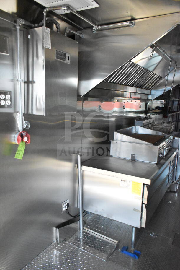 Interior of 2020 Ford F59 Food Truck, showcasing stainless steel kitchen equipment and ventilation. VIN 1F66F5KN8L0A07302.