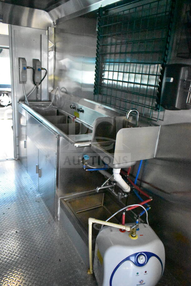 2020 Ford F59 food truck interior; stainless steel sink, plumbing, grid panel. Clean, excellent condition. VIN: 1F66F5KN8L0A07302.