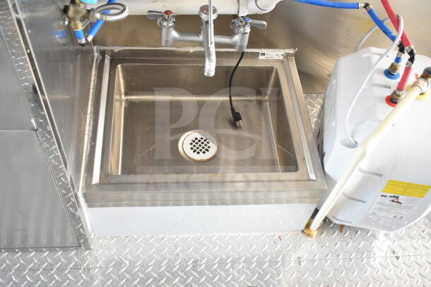 2020 Ford F59 food truck interior sink setup, featuring plumbing and wiring, on diamond plate flooring.