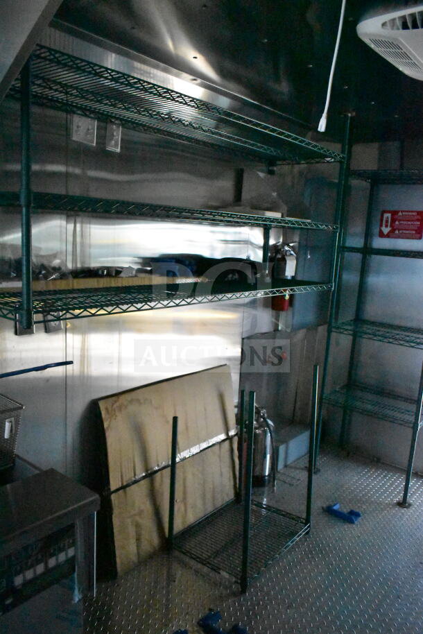 Interior of 2020 Ford F59 Food Truck, featuring shelving, grease hood, and fire suppression system. VIN: 1F66F5KN8L0A07302.