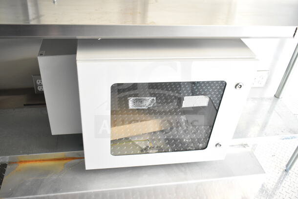 2020 Ford F59 food truck interior with Pitco fryer and chef base, featuring grease hood and suppression system.