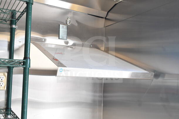 2020 Ford F59 Food Truck with installed grease hood, suppression system, green shelving, and stainless steel interior.