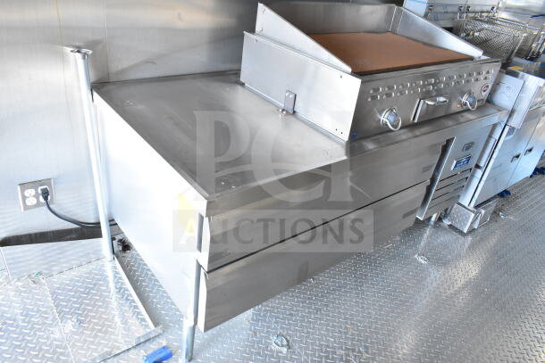 2020 Ford F59 food truck interior featuring a Pitco fryer, chef base, grease hood, and suppression system.