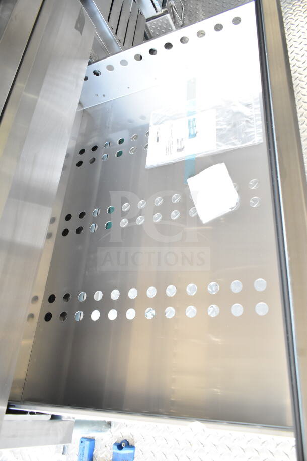 2020 Ford F59 food truck interior, featuring perforated stainless steel chef base. Includes Pitco fryer, grease hood system.