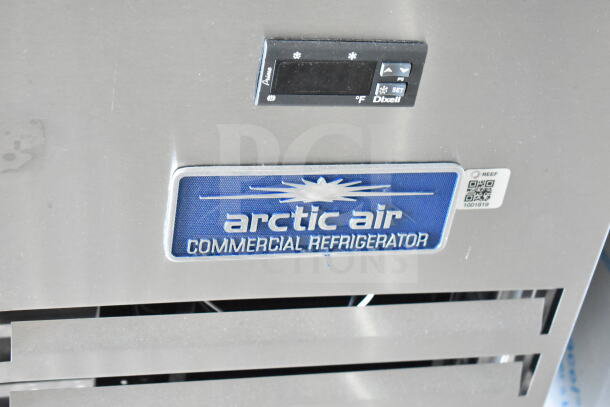 Close-up of the Arctic Air Commercial Refrigerator label with temperature control panel visible on a 2020 Ford F59 Food Truck.