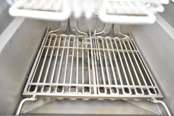 Interior view of a Pitco fryer in a 2020 Ford F59 food truck, showing clean metal grates.