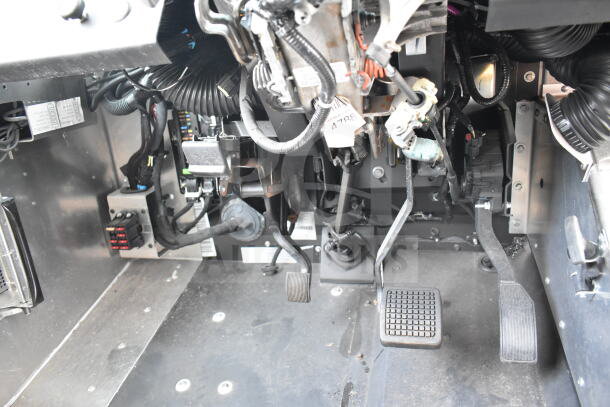 2020 Ford F59 Food Truck interior view showing pedals and wiring. Features grease hood, Pitco fryer, and chef base. VIN: 1F66F5KN8L0A07302.