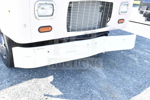 2020 Ford F59 food truck front view, visible wear on bumper, equipped with grease hood, suppression system, Pitco fryer.