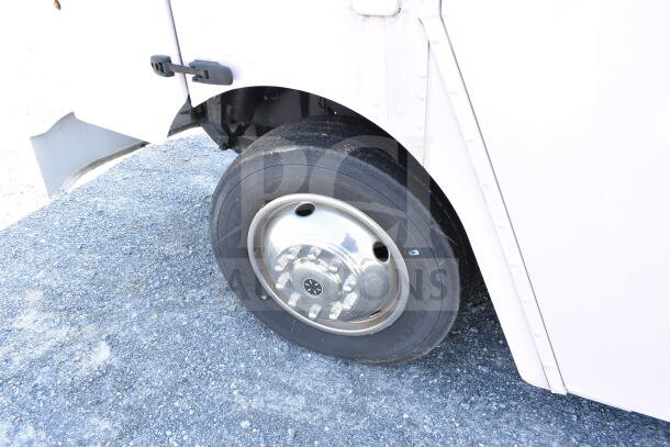 2020 Ford F59 food truck tire and wheel, shiny hubcap, good condition, VIN 1F66F5KN8L0A07302 visible.