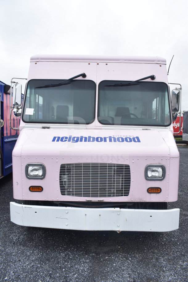 Front view of a brand new 2020 Ford F59 electric food truck in pink, featuring "neighborhood kitchens" on the hood.
