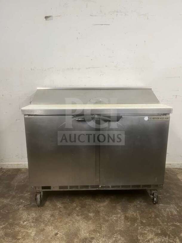 Beverage-Air 48" 2 Door Sandwich Prep Table in stainless steel, features dual doors, casters, and prep area. Good condition.