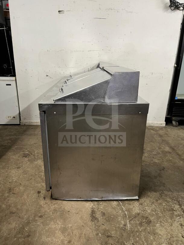 72" stainless steel sandwich/salad prep table by preptable, model 72. Features refrigerated base, used condition.