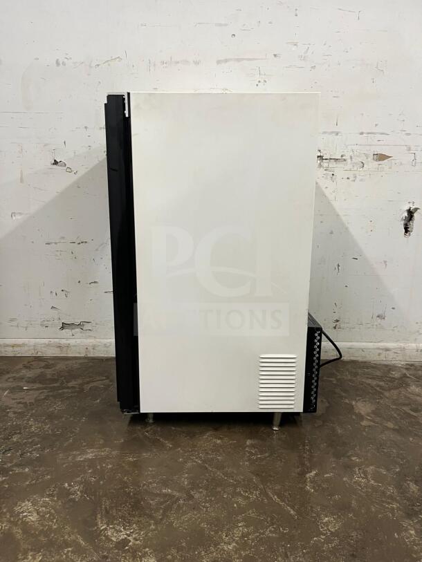 White countertop display ice cream freezer in excellent condition, features glass door, side view shown.
