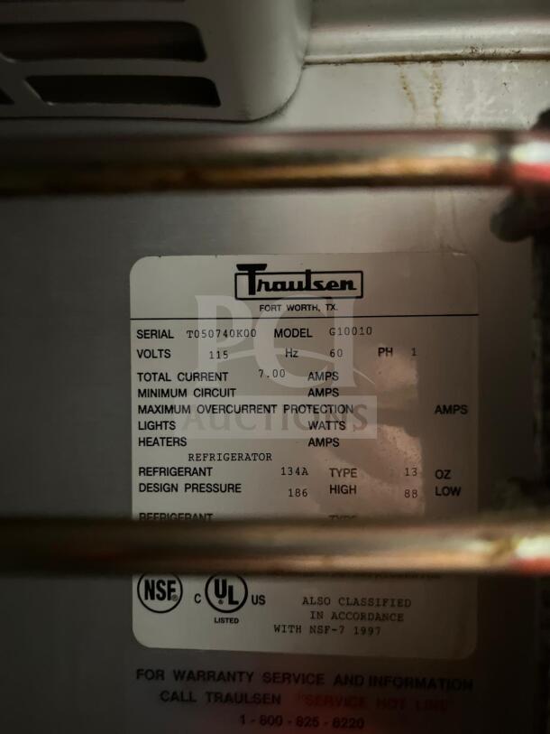 Traulsen G10010 reach-in refrigerator label showing model, serial number T050740K00, voltage 115, and refrigerant type 134A.