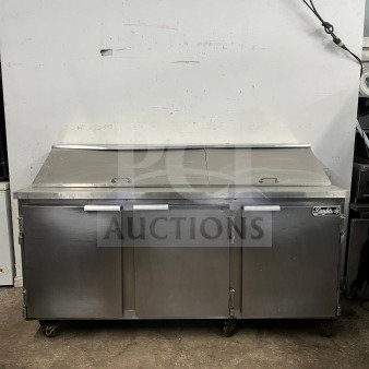 LEADER NSFM72 72" 3-door refrigerated prep table for sandwiches and salads, stainless steel, on casters, good condition.
