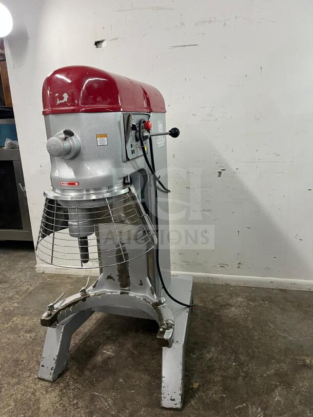 Axis AX-M80 80 Quart commercial planetary mixer, 4 speed, 4 HP. Visible wear, intact labels, red top, metal construction.