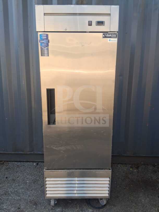 DUKERS D28R 27 1/2" reach-in refrigerator, one section, right hinge solid door. Visible brand label and warranty tag.