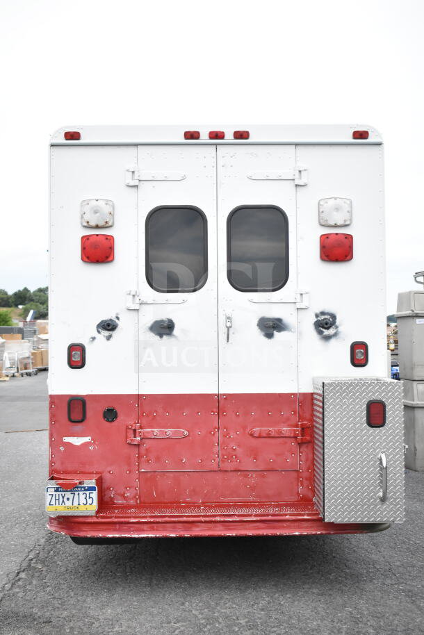 1993 GMC Step Van, VIN 1GDHP32K7R3500033. Rear view, white and red body, dual rear doors, visible wear.