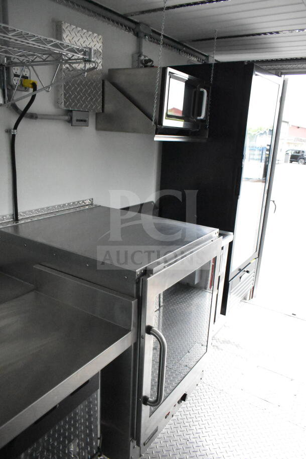 1993 GMC Step Van interior with stainless steel counters and shelving, clean condition, VIN 1GDHP32K7R3500033.