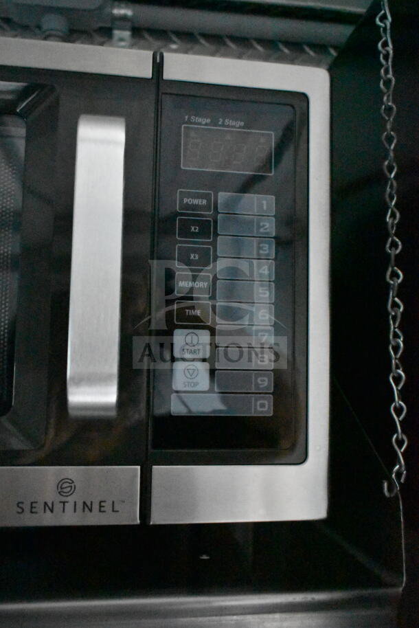Control panel of a Sentinel appliance inside a 1993 GMC Step Van. Features buttons for stage selection, power, and timing.